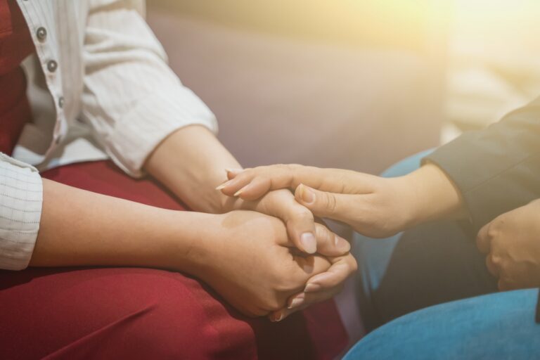 Group Ketamine Assisted Psychotherapy page image of hands showing support to another